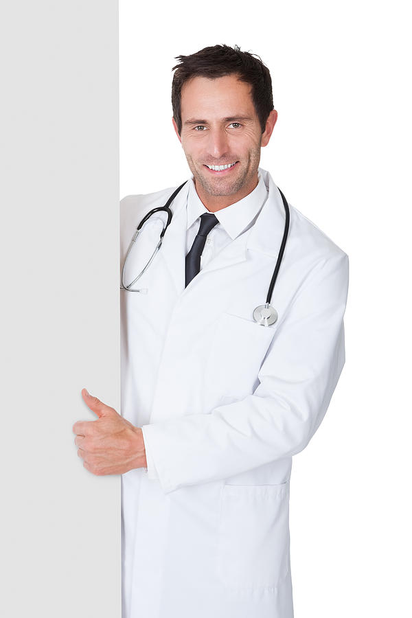 Doctor presenting empty banner Photograph by AndreyPopov