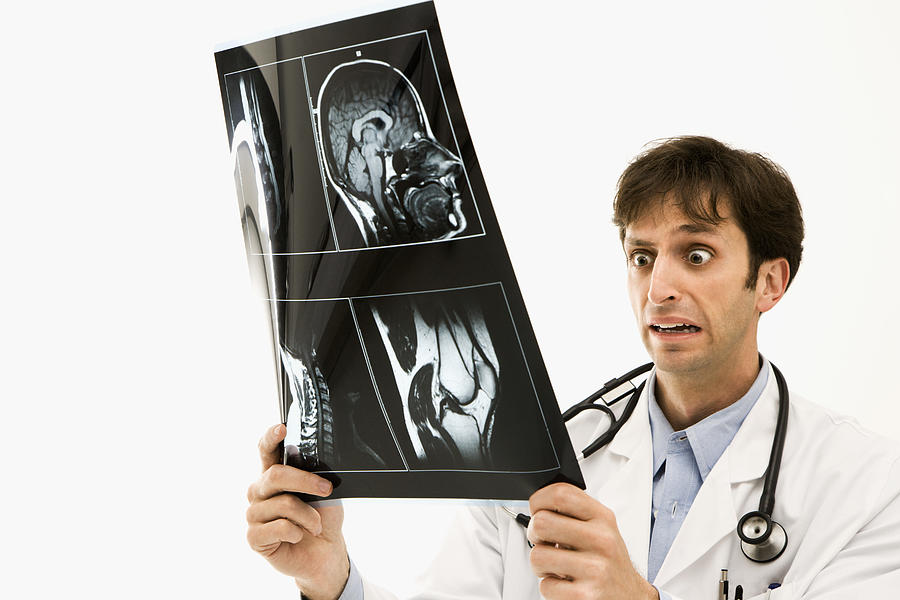 Doctor reacting to X-ray Photograph by Thinkstock Images