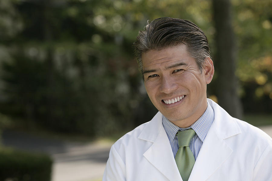 Doctor smiling Photograph by Comstock Images