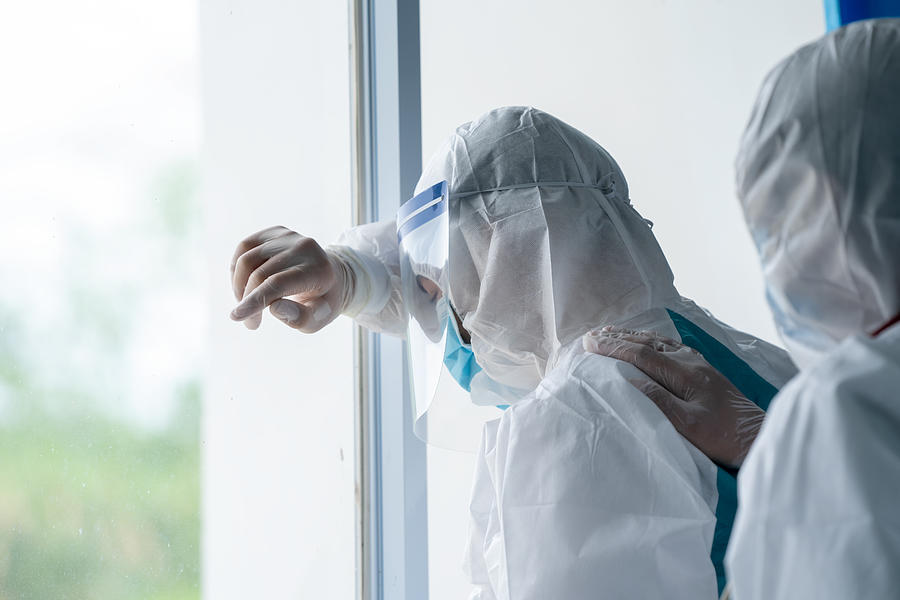 Doctor wearing protective suit to fight coronavirus pandemic covid-2019. Photograph by Visoot Uthairam