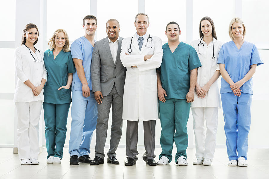 Doctors and a businessman. Photograph by Skynesher