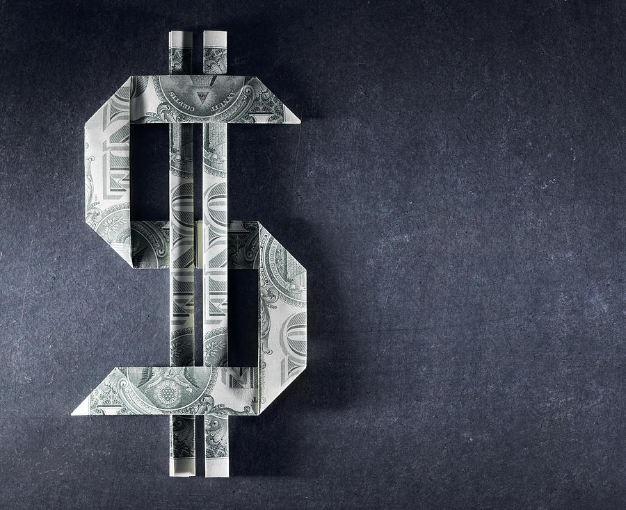 Dollar sign made from one dollar bills Photograph by Jeffrey Coolidge