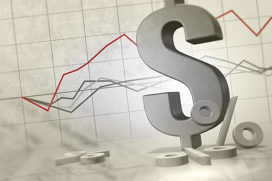 Dollar sign with line graph Photograph by Comstock Images