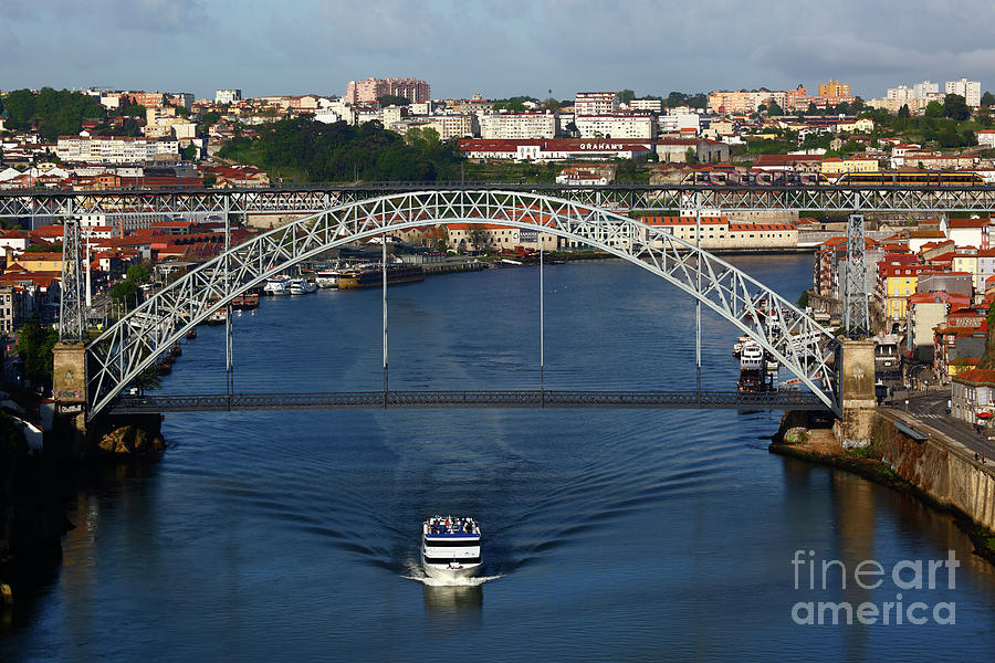 Boat Photograph - Dom Luis I Bridge and cruise boat on River Douro Oporto Portugal by James Brunker
