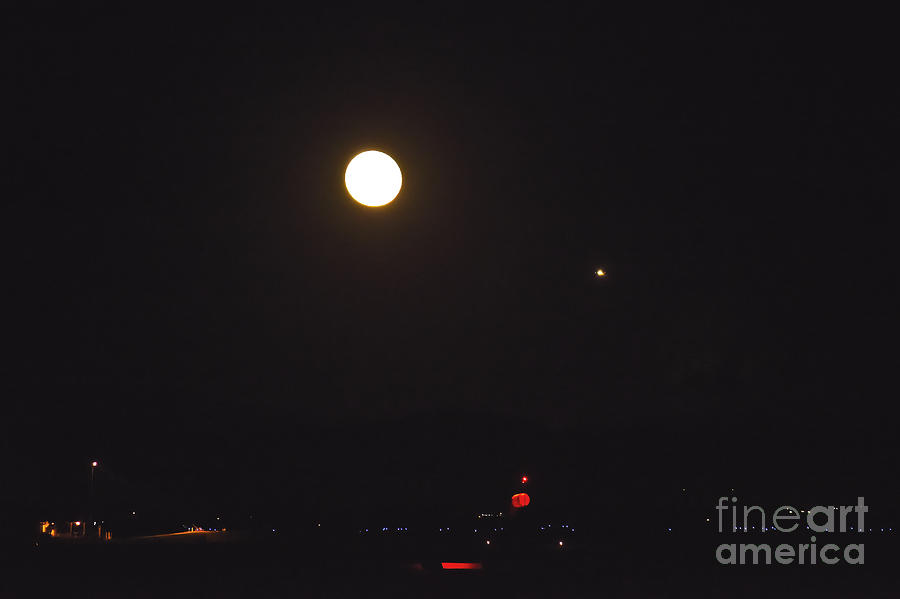 Full Moon Dwarfs Plane At Airport Photograph by Kae Cheatham