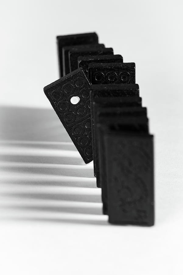 Domino blocks in a row on a white background Photograph by Michalakis Ppalis