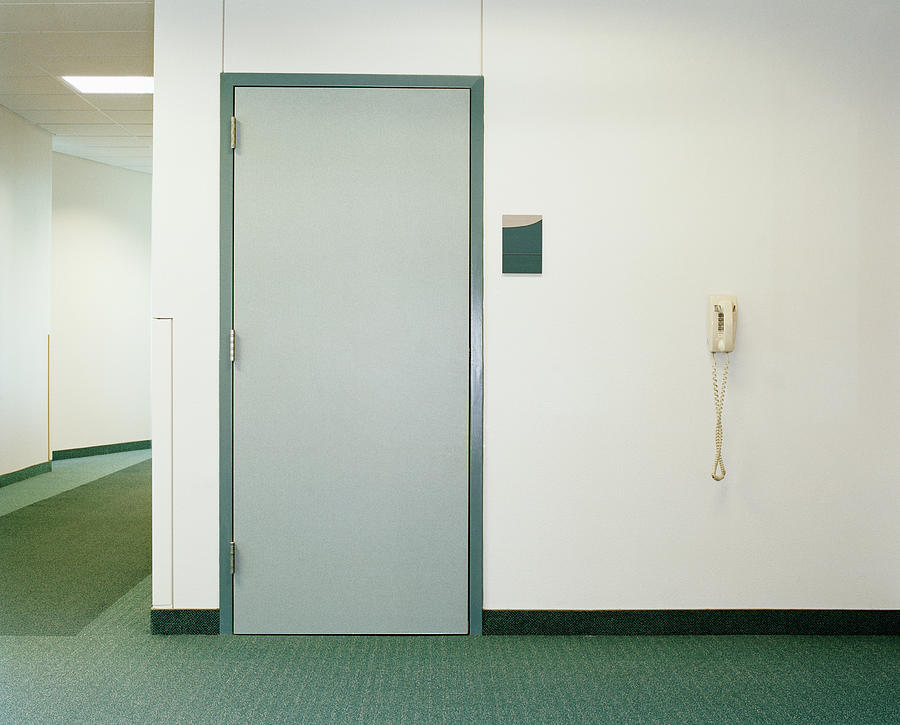 Door and telephone in building hallway Photograph by Erik Von Weber