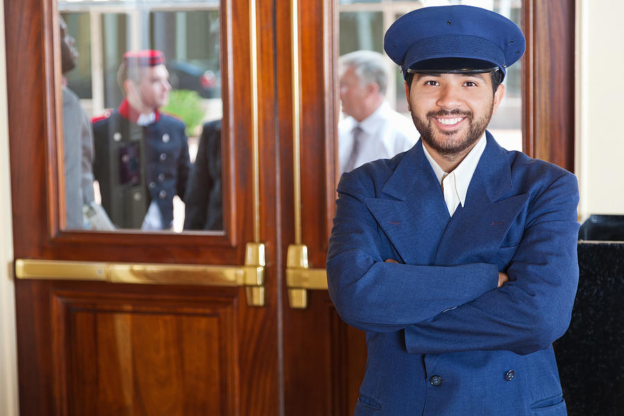 Door man portrait at a 5-Star hotel entrance Photograph by SDI Productions