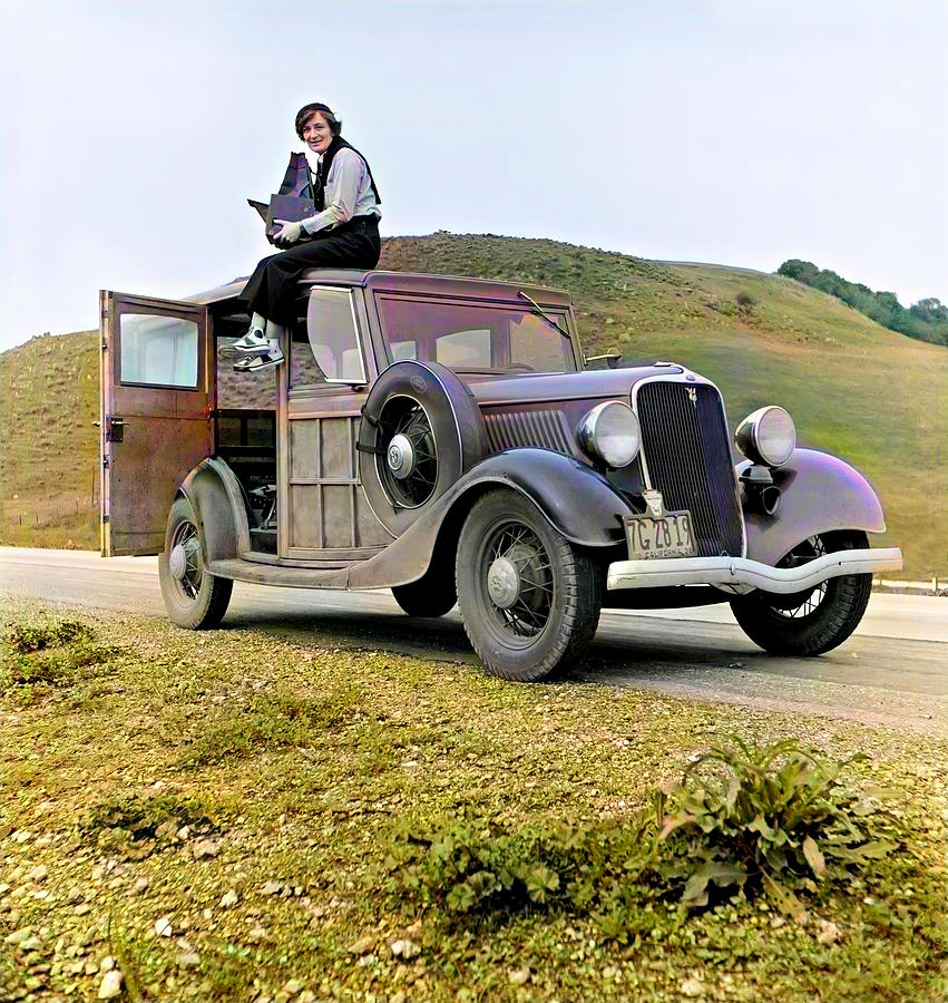 Dorothea Lange Sitting on Top of a 1933 Ford Station Wagon Photograph by Rondal Partridge