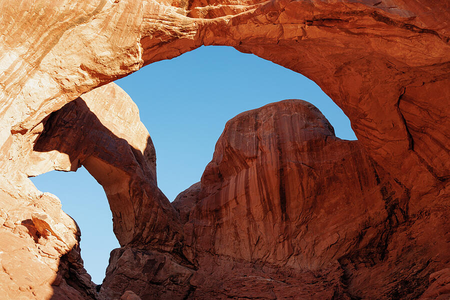 Natural Stone Arch Under Blue Sky Photograph - Double Arch Dawn, Arches National Park by Robert Niemeier