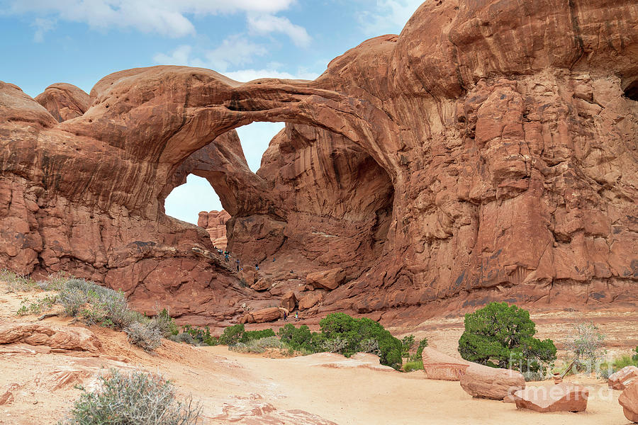 Double Arch Hikers In Utah Photograph