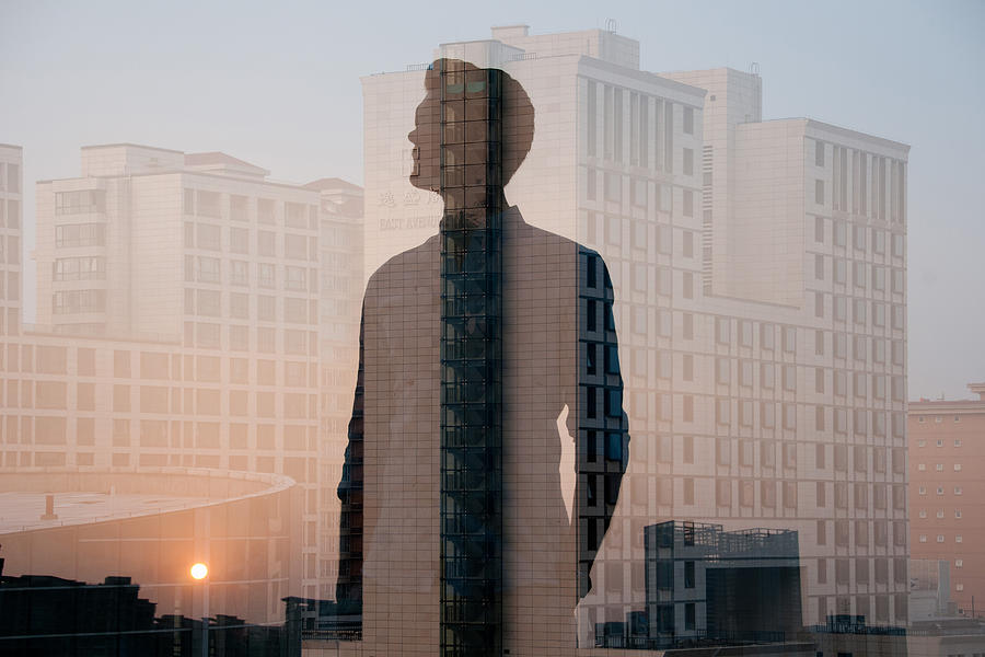 Double Exposure Of Man And Buildings Photograph by Jasper James