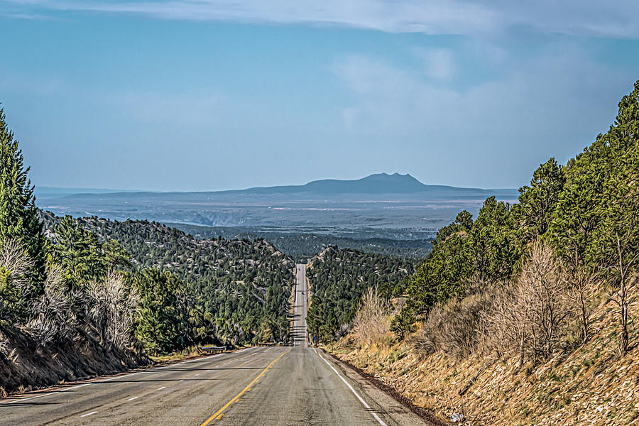 Down Hill and Southbound to Taos NM Photograph by Debra Martz