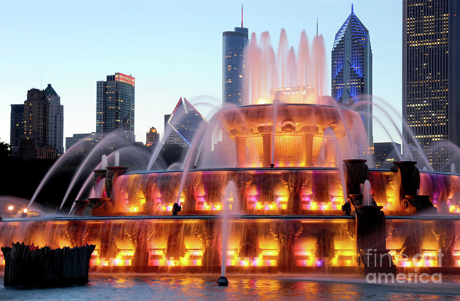 Downtown Chicago on a summers evening with iconic park, water fountain, and cityscape views.  Photograph by Gunther Allen