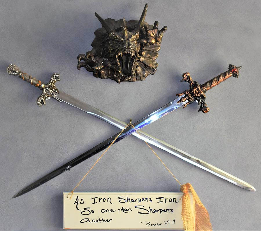 Dragon head, crossed swords, scripture Photograph by Sandra Souder - Pixels