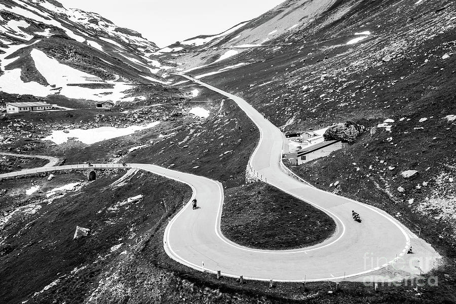 Dramatic black and white view of the Klausenpass hairpin road in Photograph by Didier Marti