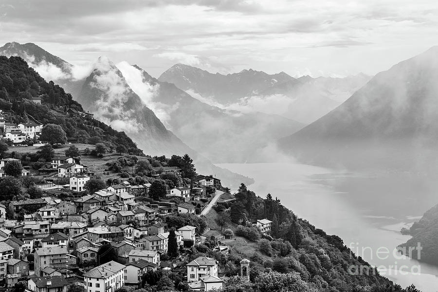 Dramatic black and white view of the of Monte Bre village and l Photograph by Didier Marti