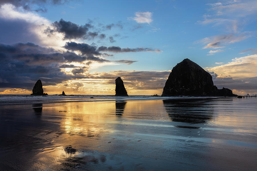 Dramatic clouds at Cannon Beach Photograph by Mike Centioli - Pixels