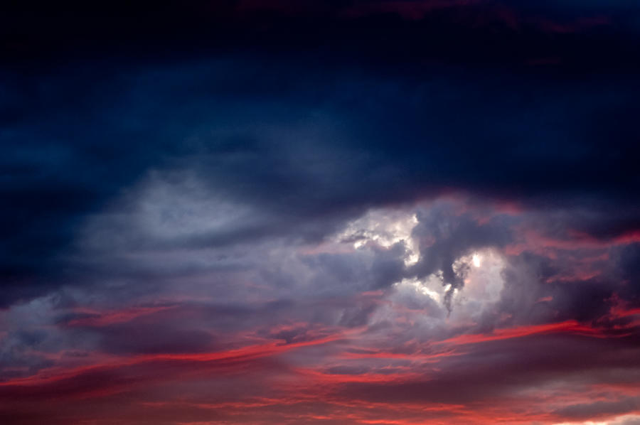Dramatic clouds at sunset Photograph by Nicolo Sertorio