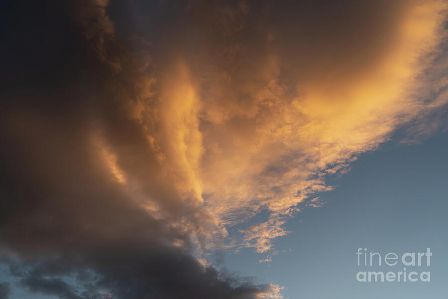 Dramatic clouds and golden light in the evening sky Photograph by Adriana Mueller Dramatic clouds and golden light in the evening sky Photograph by Adriana Mueller