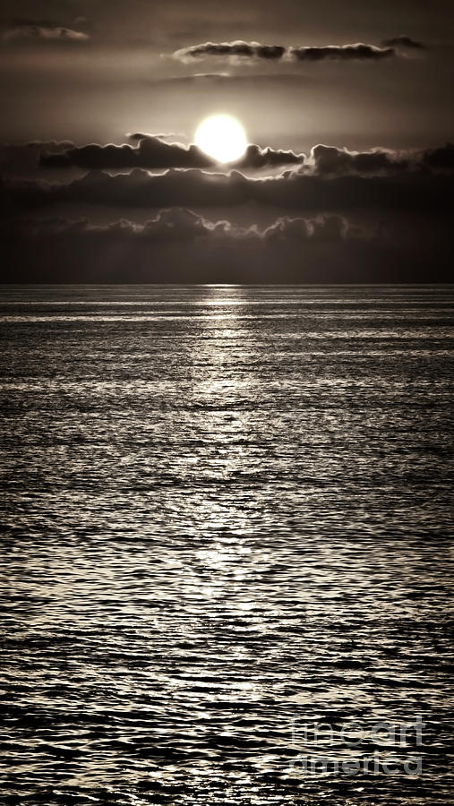Dramatic Sun Setting Into Clouds At Sea Photograph by Tatiana Bogracheva