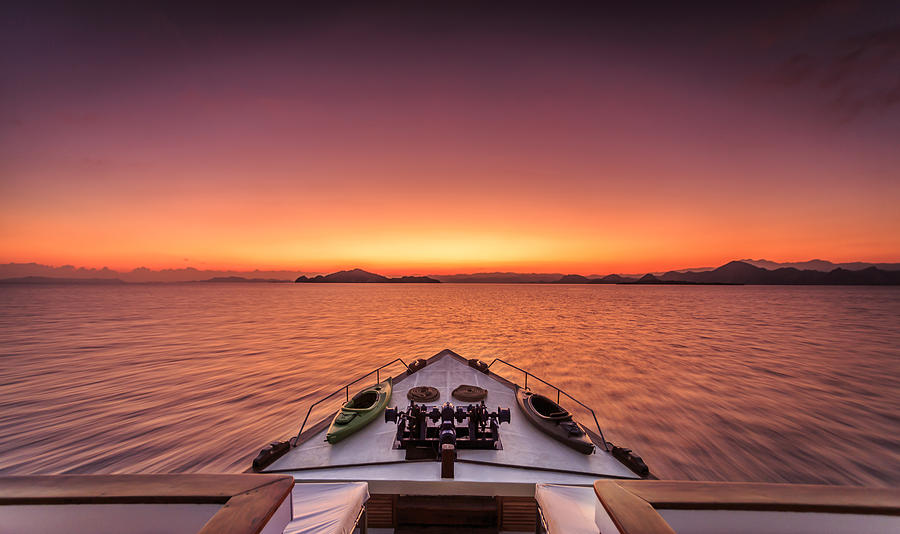 Dramatic sunrise at sea on a luxury yacht Photograph by Joakimbkk