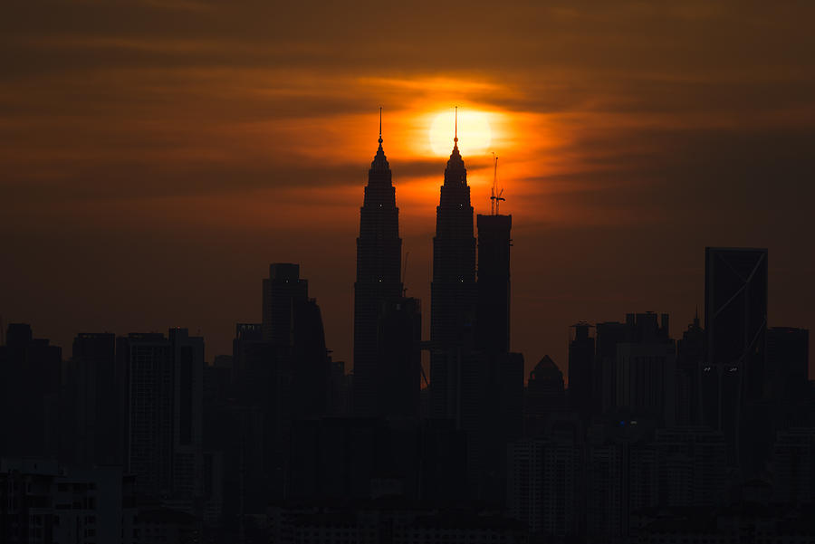 Dramatic sunset in downtown Kuala Lumpur, Malaysia Photograph by Shaifulzamri