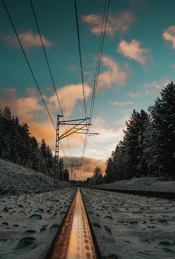 Dramatic sunset on a snow-covered railway Photograph by Vaclav Sonnek