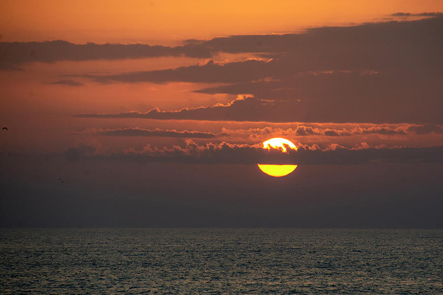 Dramatic sunset over the Gulf of Mexico Photograph by Bob Silverman ...