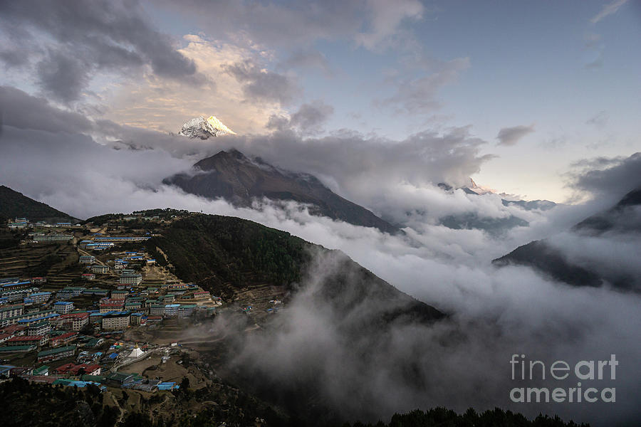 Dramatic view of the Namche Village with clouds flooding the val Photograph by Didier Marti