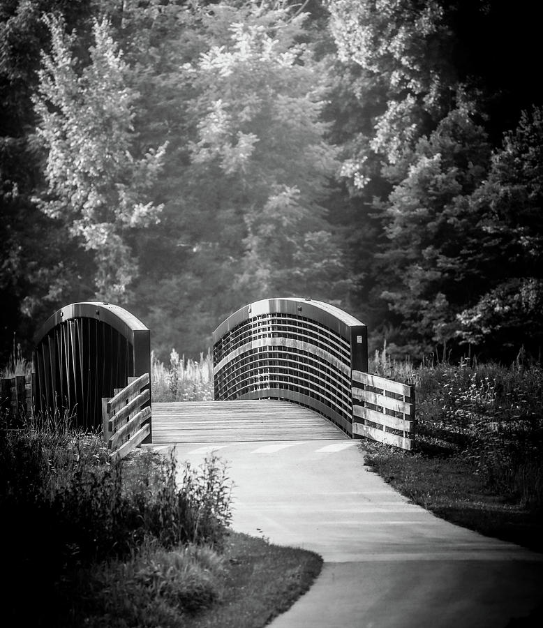 Dramatically Lit Walking Bridge Photograph by Dan Sproul