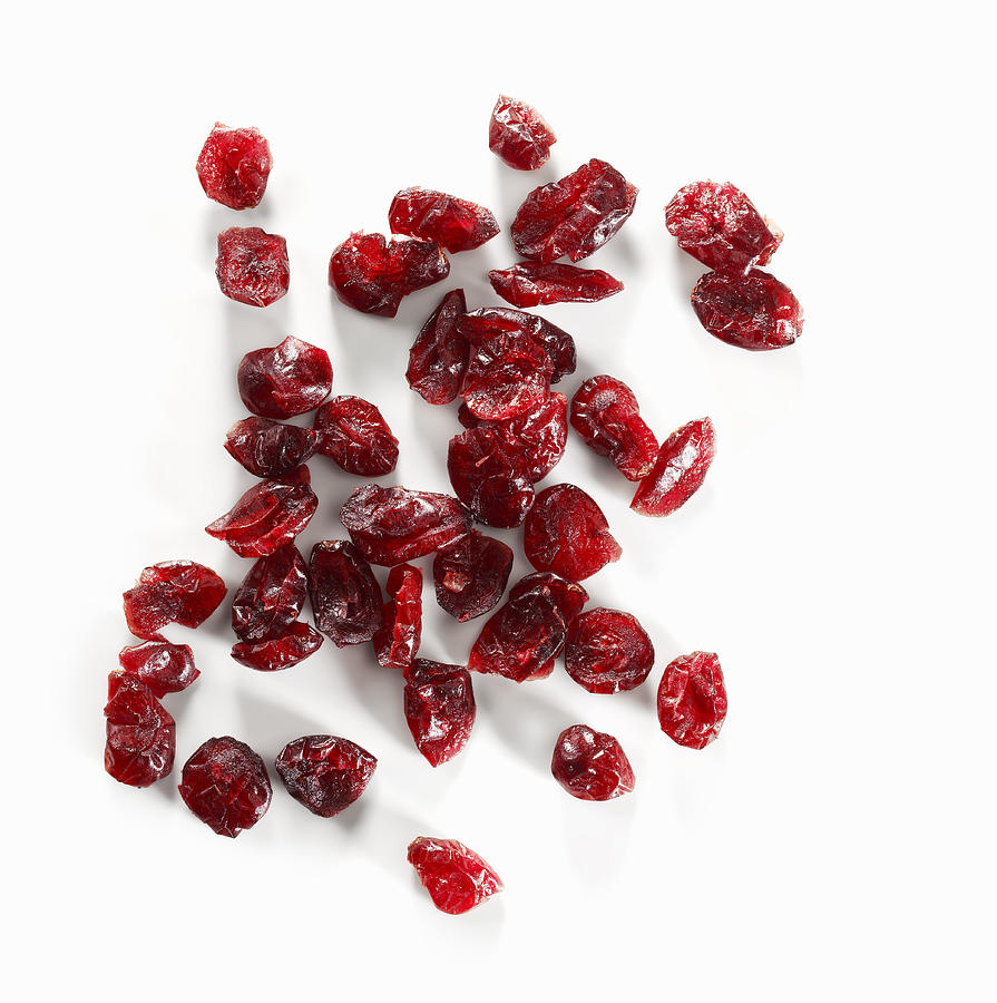 Dried cranberries on white background Photograph by Foodcollection RF