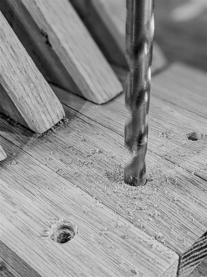 Drilling wooden plank close up Photograph by Alex Grichenko