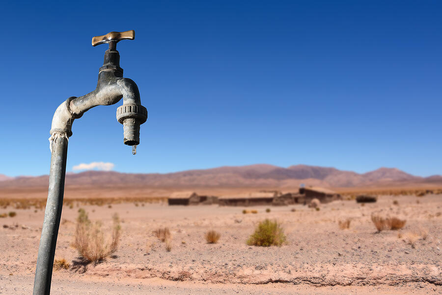 Drips faucet and dry environment in the background Photograph by Angelo DAmico