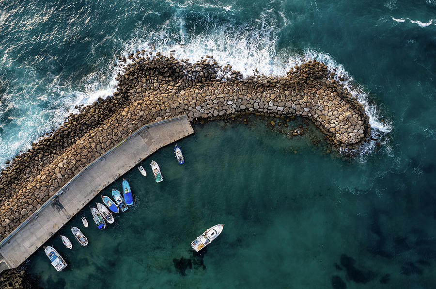Drone aerial fishing harbour with boats stormy waves, blue sea Photograph by Michalakis Ppalis