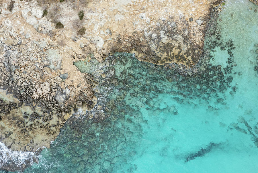 Drone Aerial Of Rocky Sea Coast With Transparent Turquoise Water. Seascape Top View Photograph