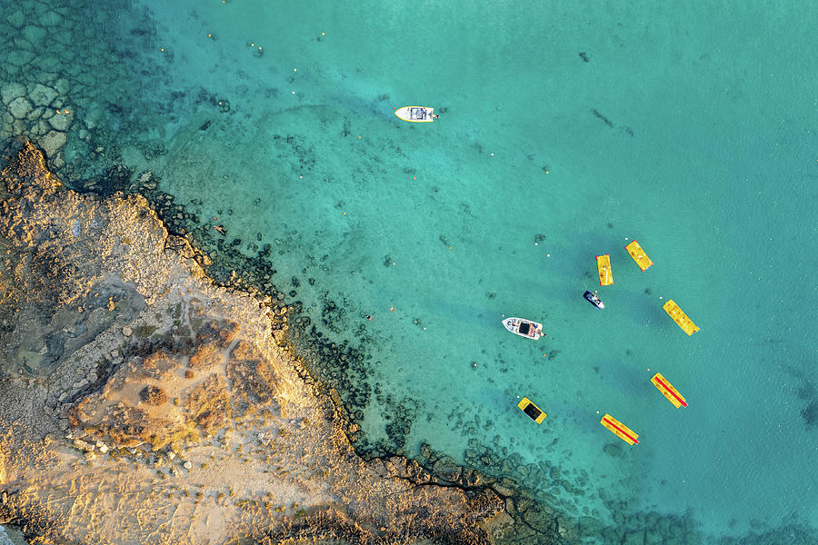 Drone aerial of seascape with idyllic blue calm blue water. Fig tree bay beach Protaras Cyprus Photograph by Michalakis Ppalis
