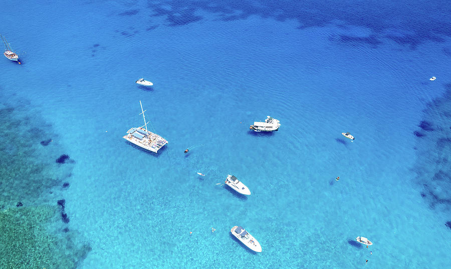 Drone aerial seascape luxury yachts moored in the coast unrecognised people swimming and relaxing. Summer vacations in the sea. Ayia Napa Cyprus Photograph by Michalakis Ppalis