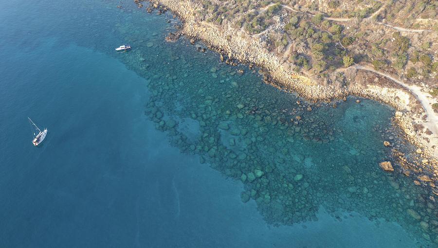 Drone aerial seascape with yacht moored in the coast. Summer vacations in the sea. Ayia Napa Cyprus Photograph by Michalakis Ppalis