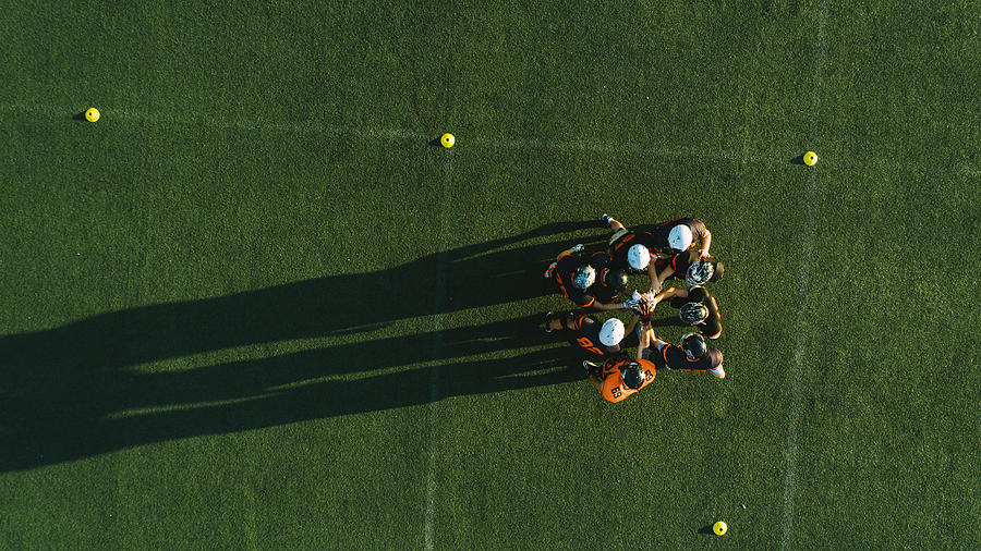 Drone point view of players huddling Photograph by Miodrag Ignjatovic