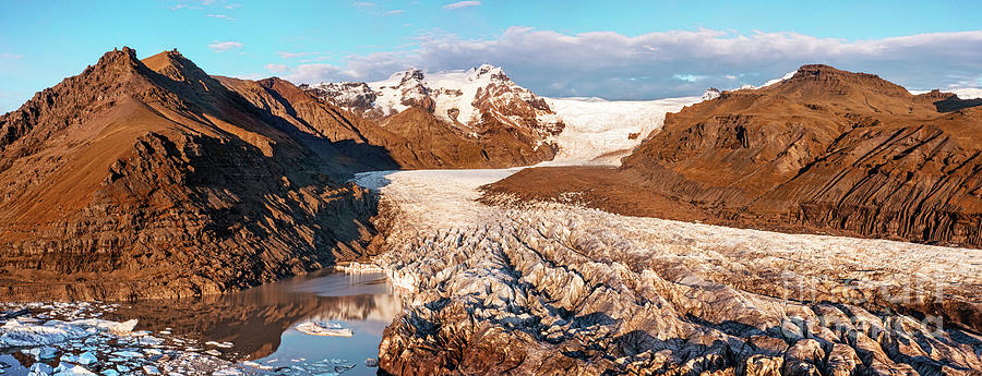 Drone shot of the Svinafellsjokull glacier, mountains and glacial lagoon. Wide panorama in autumn. Vatnajokull Naional Park Photograph by Jane Rix