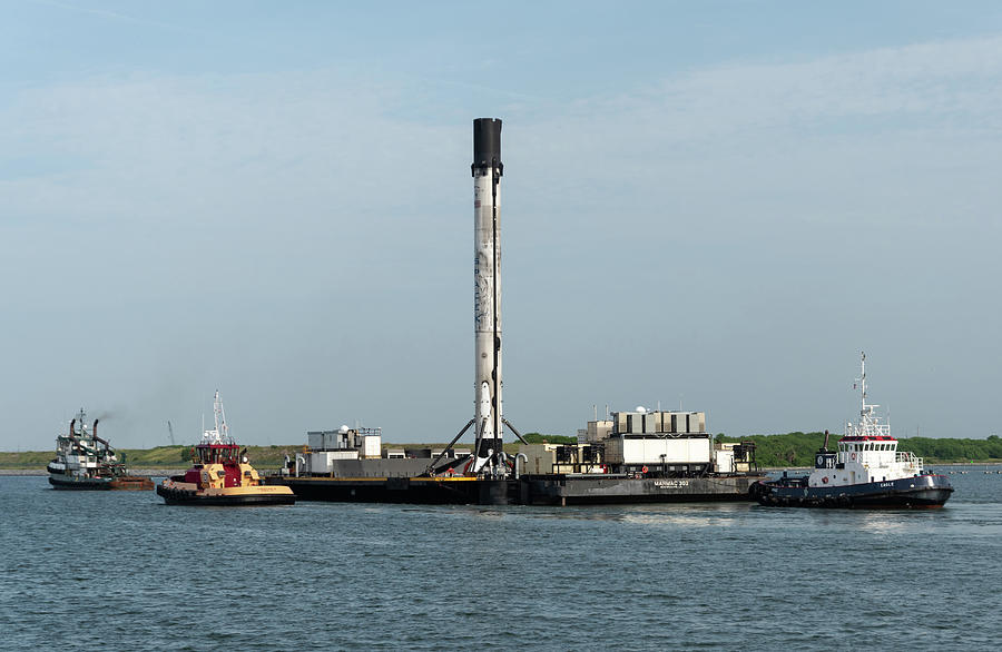Droneship with SpaceX rocket and Tugs.  Photograph by Bradford Martin