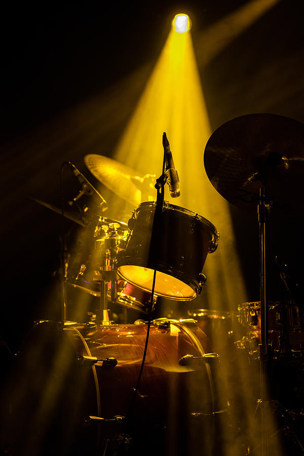 Drum set on stage under a yellow light Photograph by Ernesto r. Ageitos Drum set on stage under a yellow light Photograph by Ernesto r. Ageitos