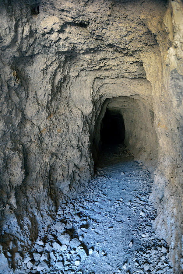 Dug mine entrance tunnel in Titus Canyon, Death Valley, California Photograph by Kevin Oke