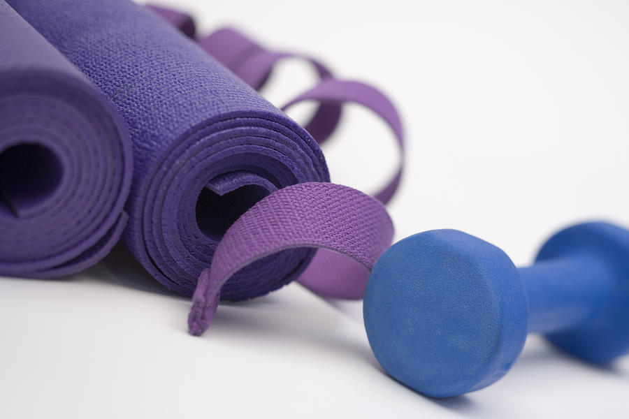 Dumbbell and exercise mats Photograph by Comstock Images