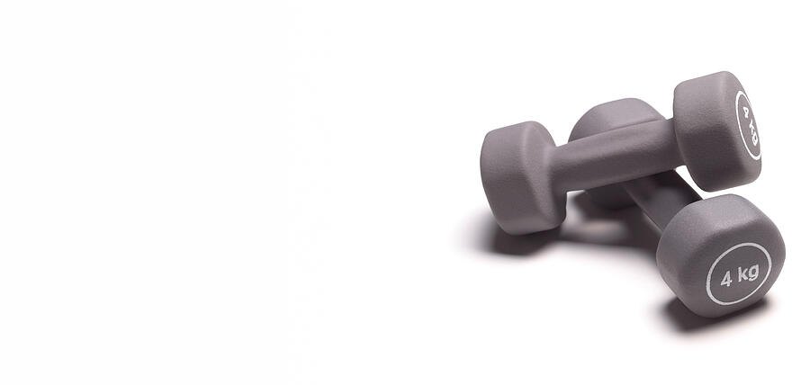 Dumbbells with copy space Photograph by Peter Dazeley