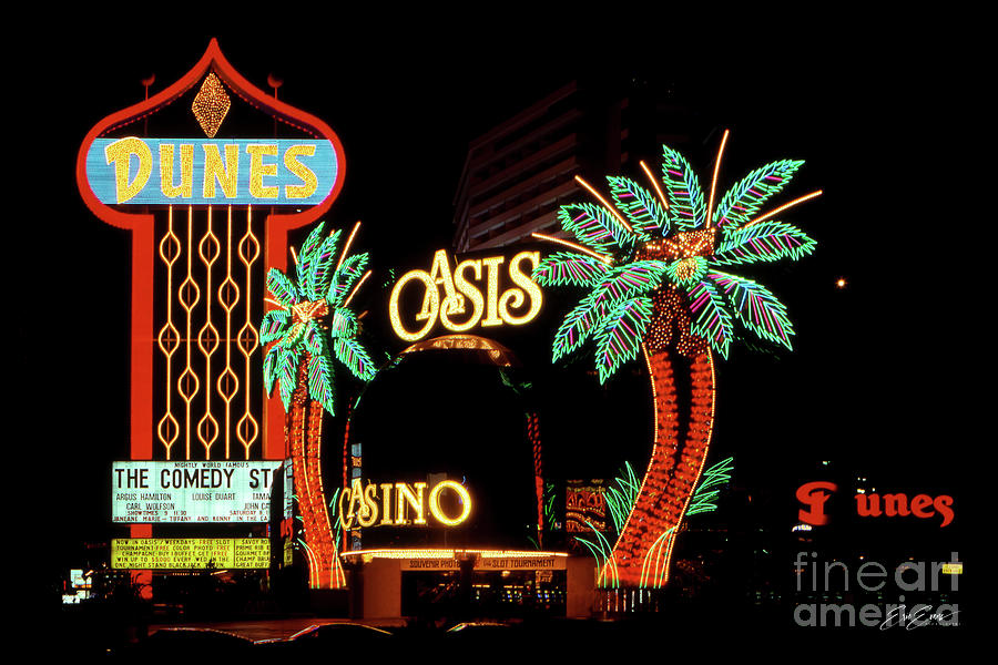 Dunes Casino and Oasis Casino Neon Signs at Night Photograph by Aloha Art