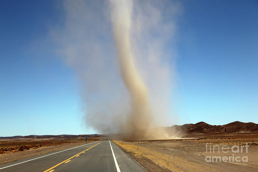 Dust devil in the Bolivian altiplano Photograph by James Brunker