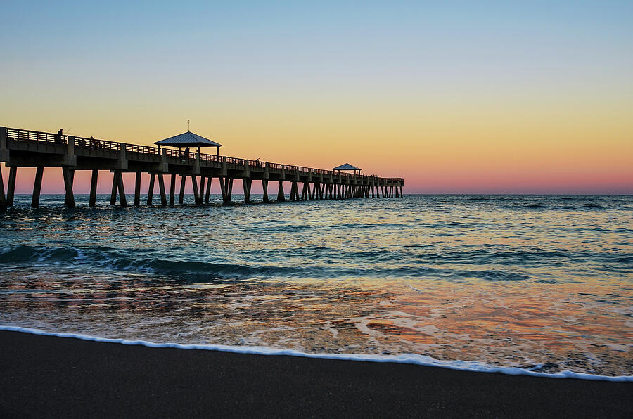 Sunset Photograph - Early Birds at Juno Pier by Laura Fasulo