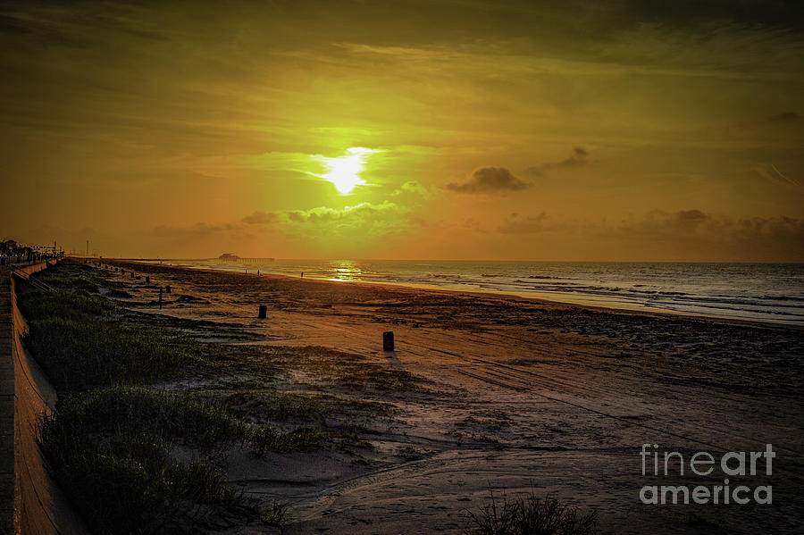 Early morning sunrise at Galveston Beach, Texas.  Photograph by Gunther Allen